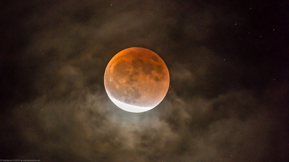 Clouds intrude on the later phases of the lunar eclipse